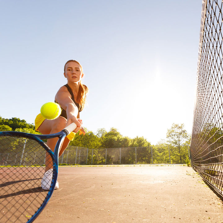 Woman playing tennis, hitting tennis ball with tennis racquet  #1-wahle-dein-profil_high